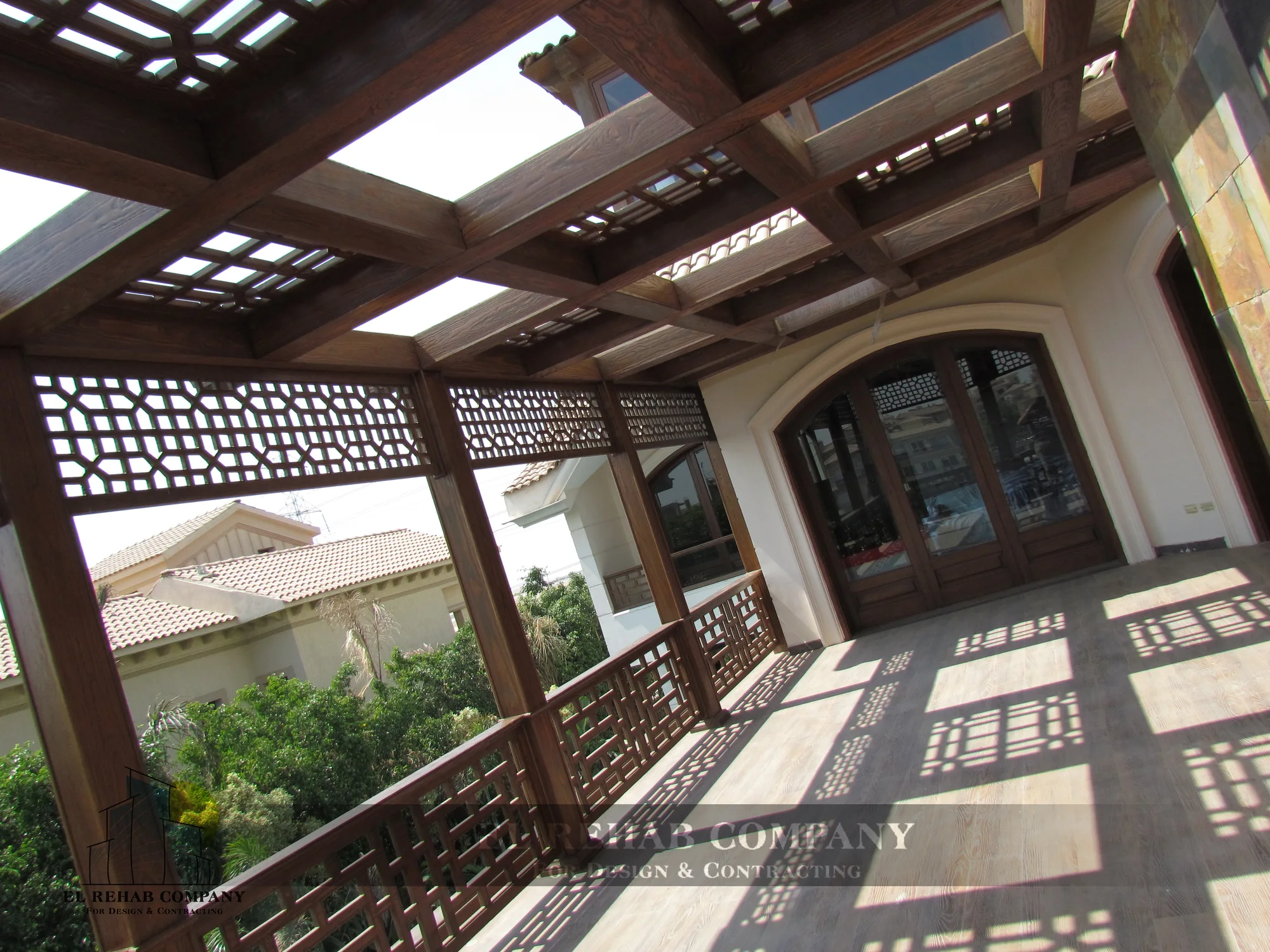 Shaded terrace beneath a timber pergola